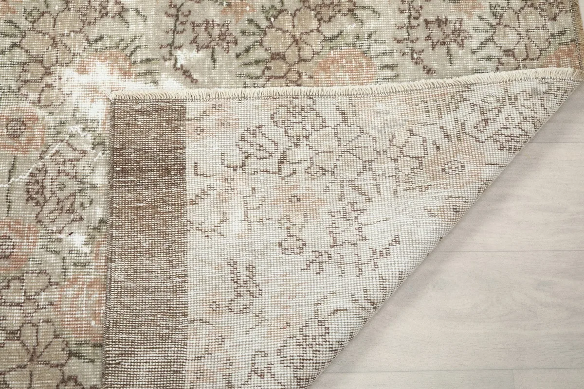 Another view of the rug's underside, displaying the consistent knotting and structure