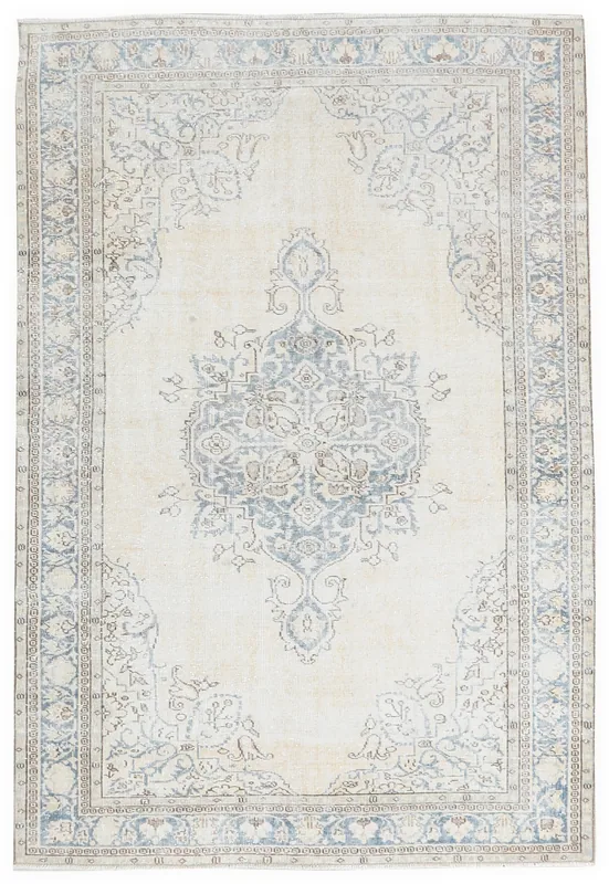 Full top view of the 5'0" x 8'3" ivory and blue vintage Anatolian rug on a white background.