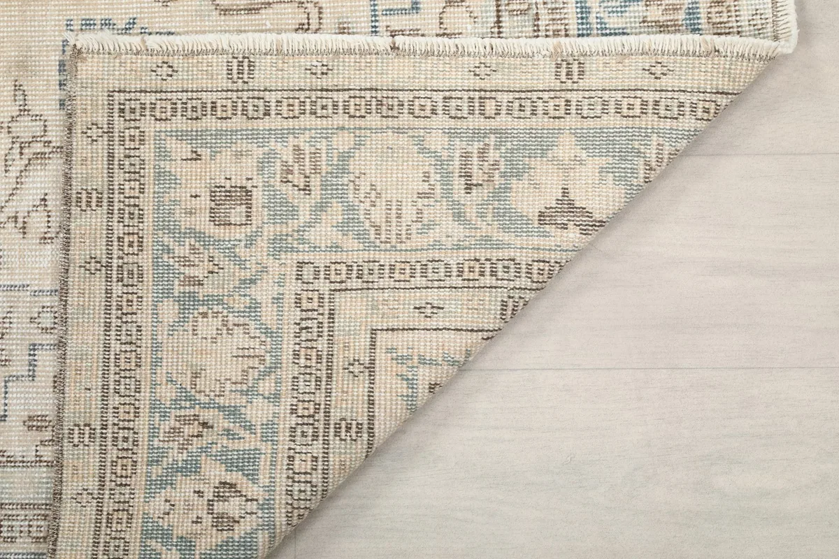 Another folded corner shot, showing the back of the rug and the construction.