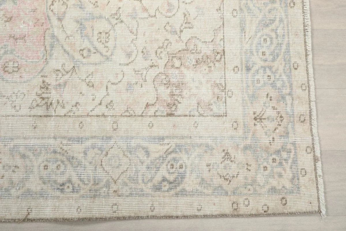 Detail of the intricate border design and corner of the hand-knotted rug