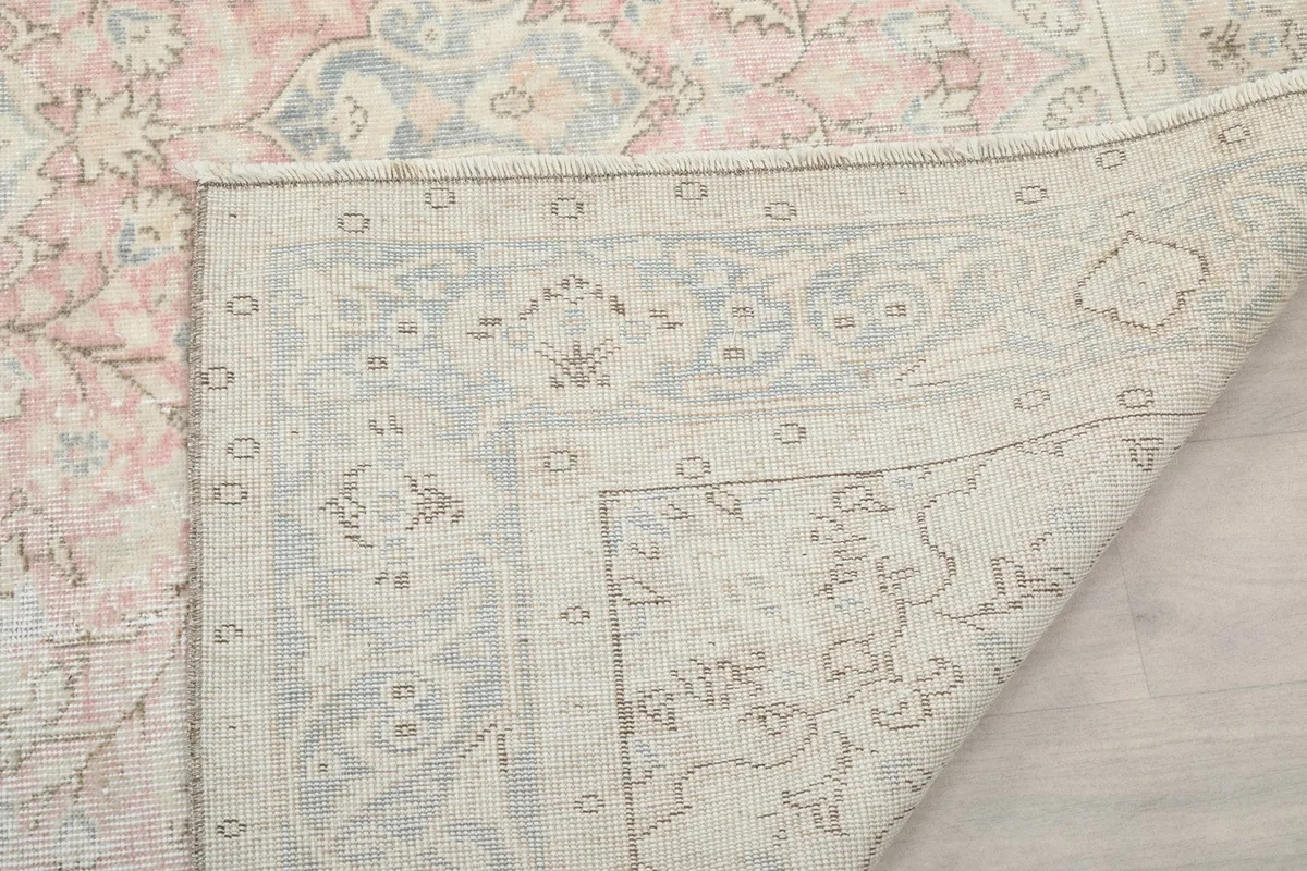 Corner view of the rug's back, showing the consistent knotting and structure