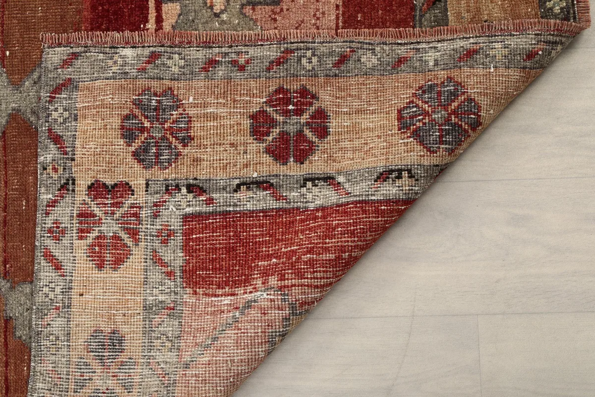 Underside and edge of the vintage runner, showing the craftsmanship and foundation