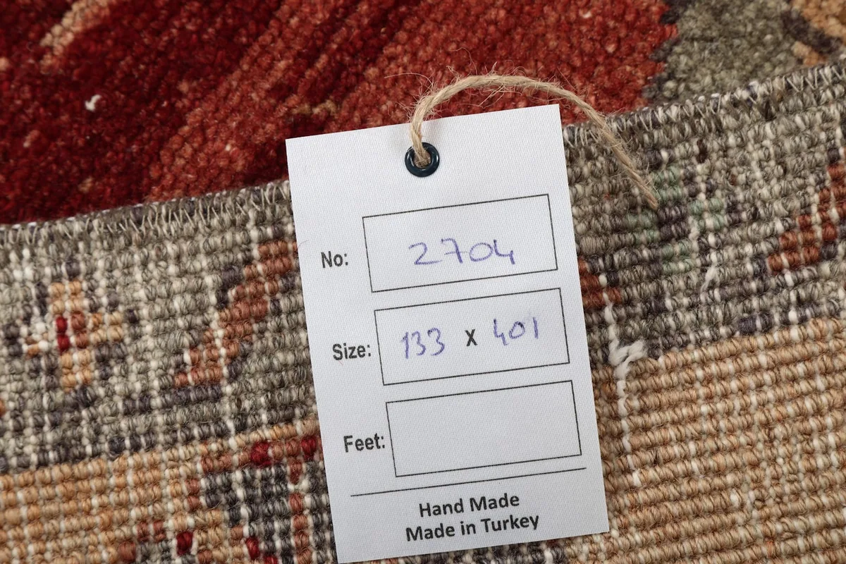 Product tag on the rug showing the item number and size in centimeters
