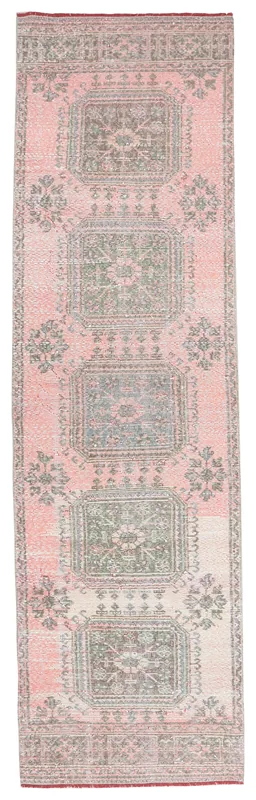 Full overhead view of the rose and gray geometric Anatolian runner rug on a white background.