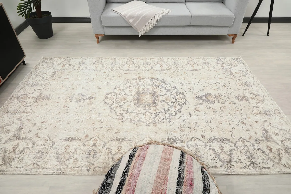 Top-down view of the rug in a room, emphasizing the central medallion and overall pattern.