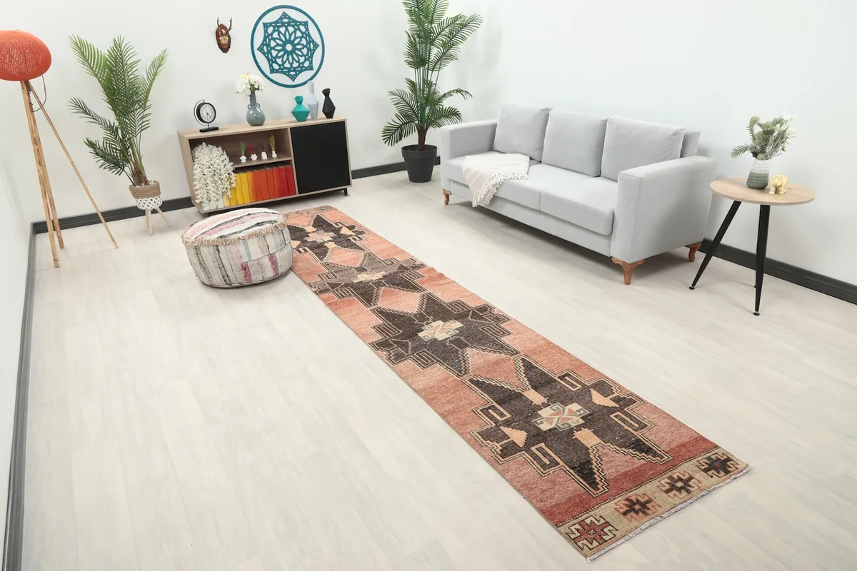 Angled view of the runner rug in a living room, showing its length and how it complements the decor.