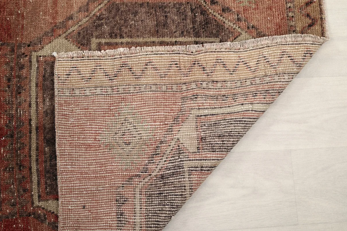 Underside of the rug showing the tight knotting and construction of the vintage piece