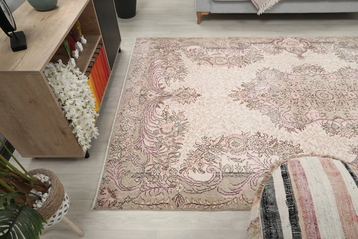 Wide angle view of the rug in a room, demonstrating its large size and overall aesthetic