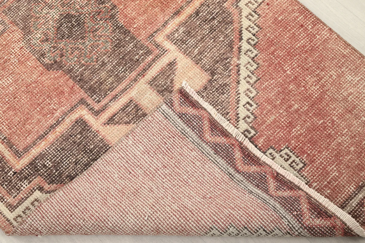 Underside view of the Rust Gray Geometric Anatolian Runner, revealing the hand-knotted cotton foundation.