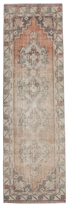 Full top view of the vintage Anatolian runner rug with rust and beige geometric patterns