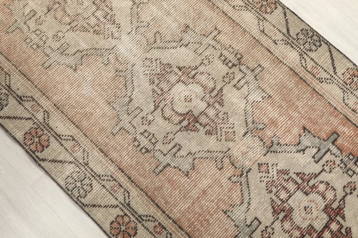Overhead view of the central geometric medallion and surrounding patterns on the runner