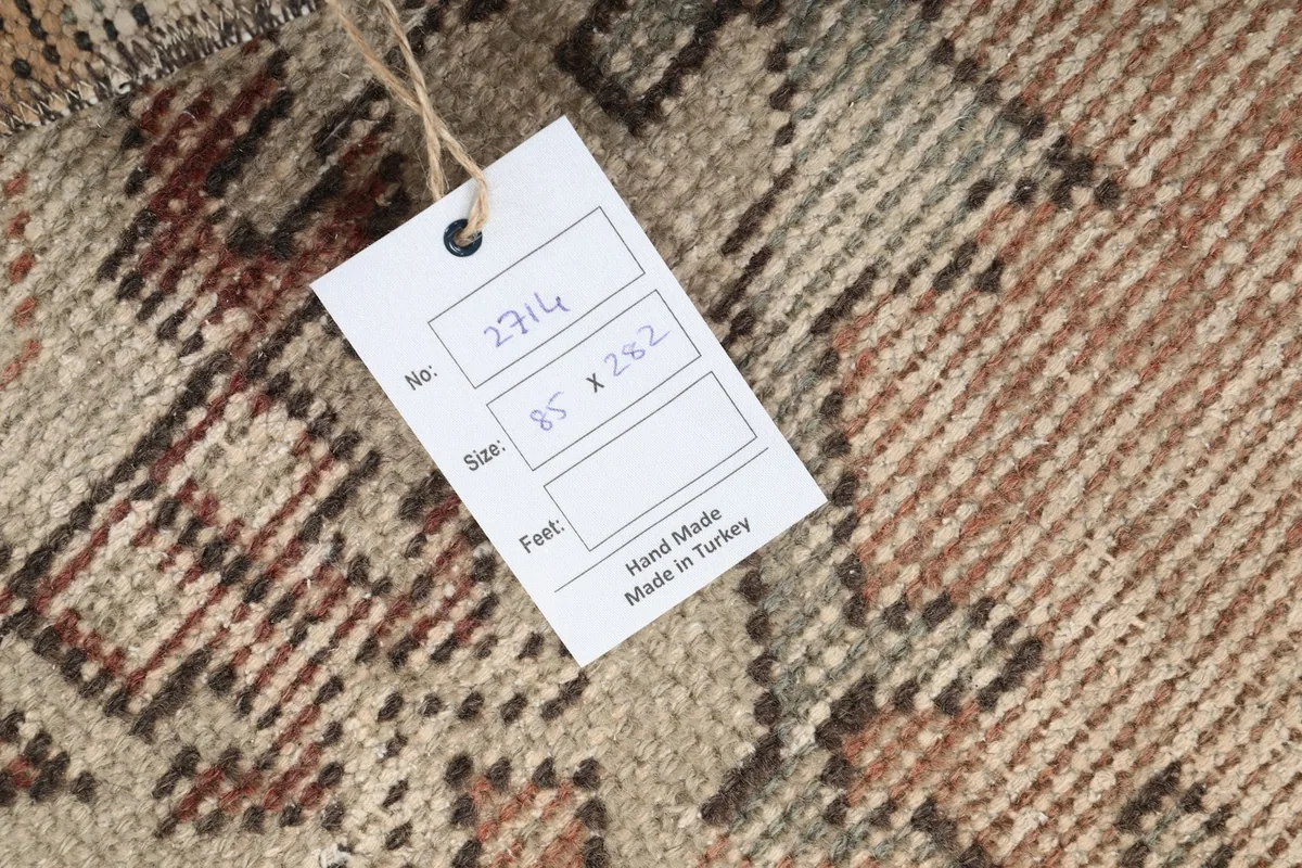 Tag showing the rug's dimensions and 'Hand Made in Turkey' on the back