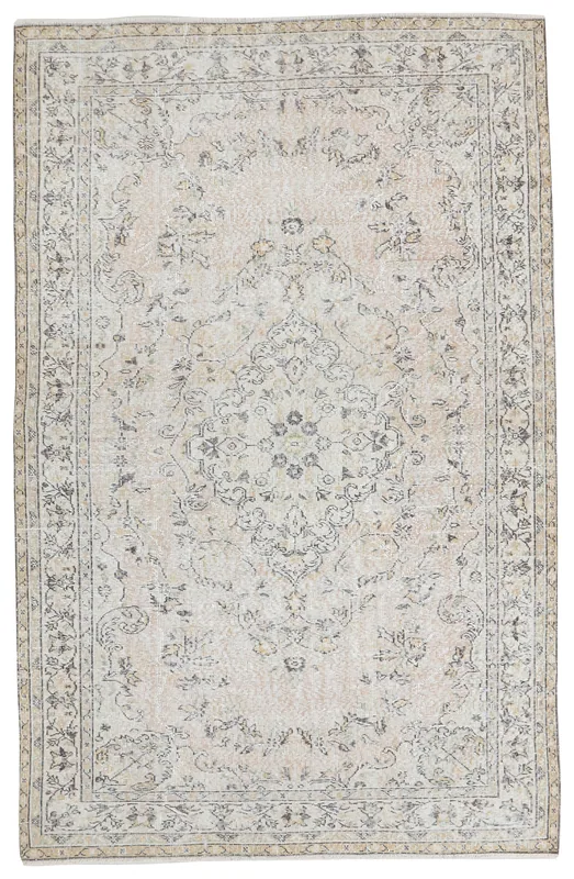 Full overhead view of the ivory floral medallion vintage Anatolian rug