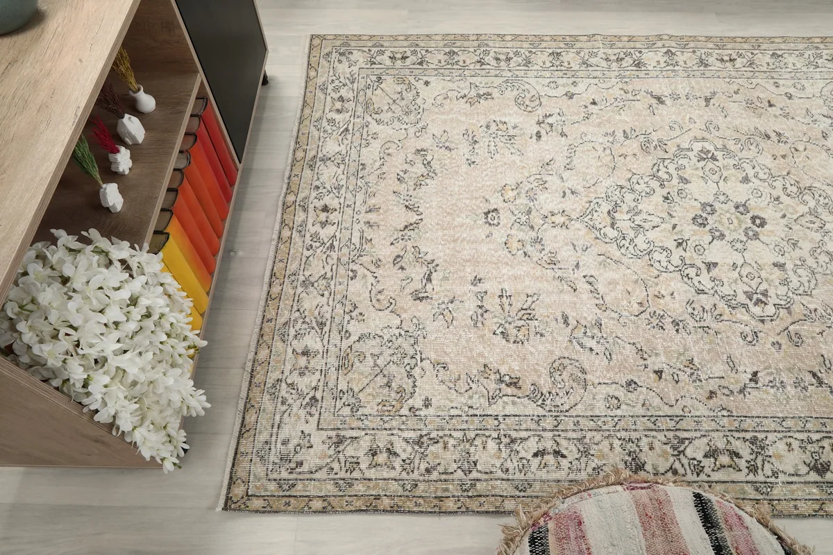 Wide angle view of the rug in the room, showing its texture and color variations