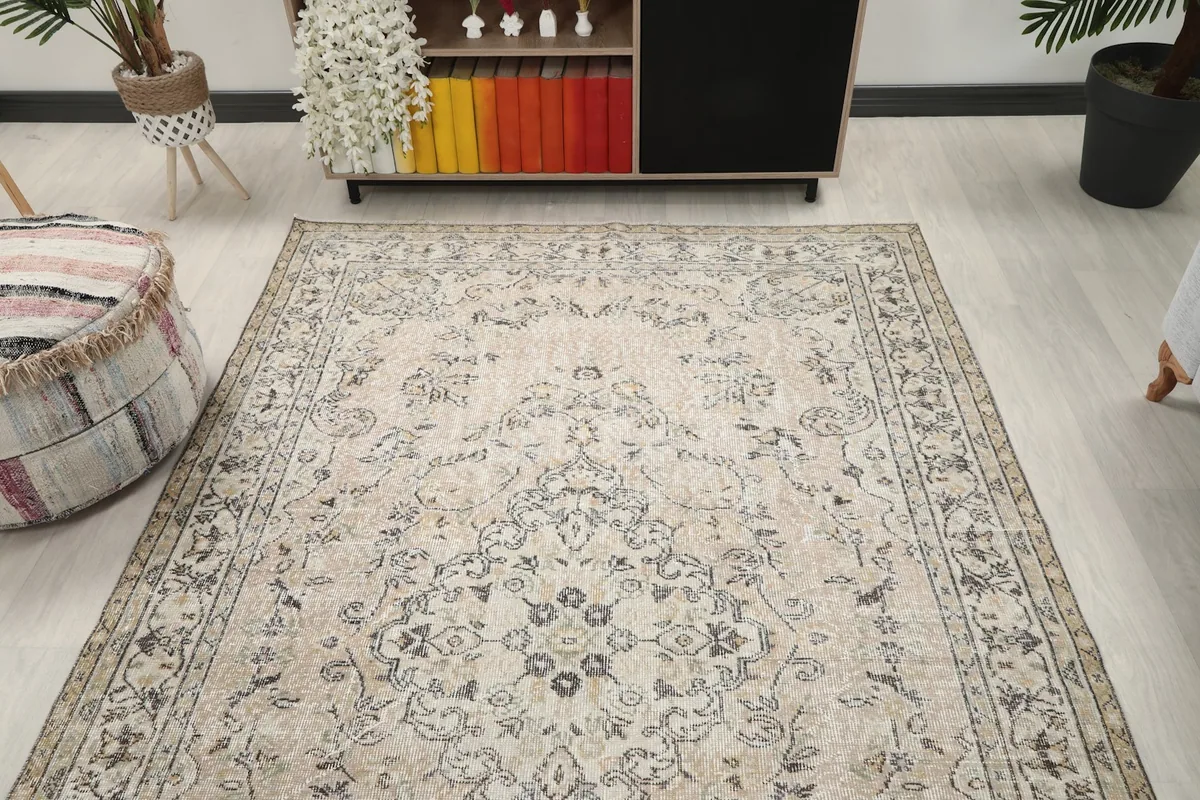 Overhead view of the ivory rug in a room setting, showcasing its full design