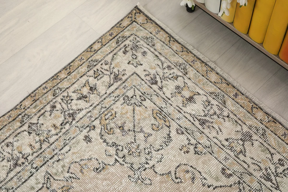 Detailed corner view of the rug, showing the border and field patterns