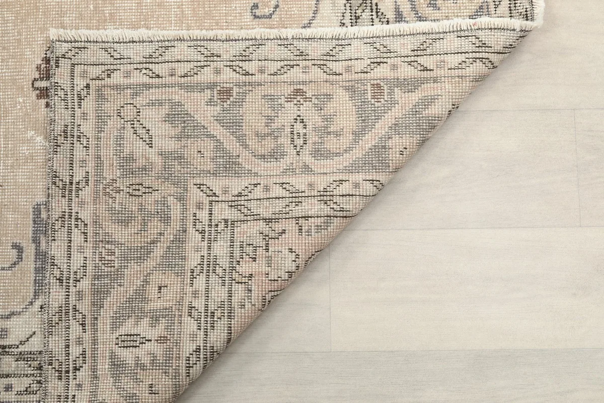 Close-up of the back of the rug, showing the dense hand-knotting and foundation