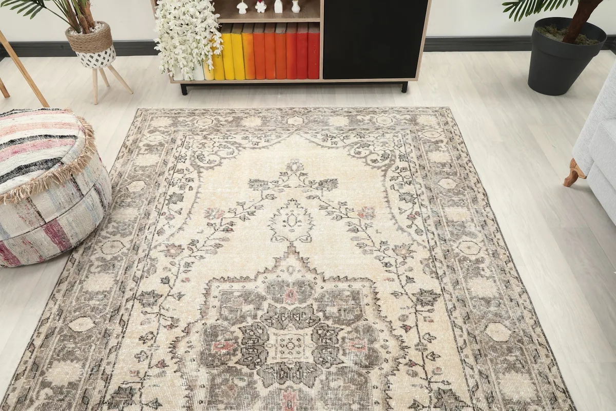 Wide angle view of the rug in a living room, showcasing its overall size and pattern.
