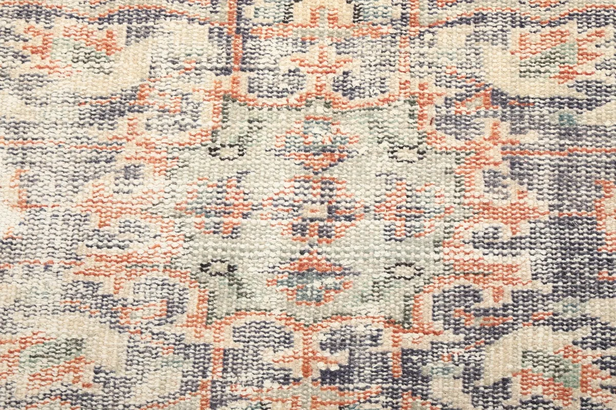 Detailed close-up of the intricate patterns within the rug's central medallion