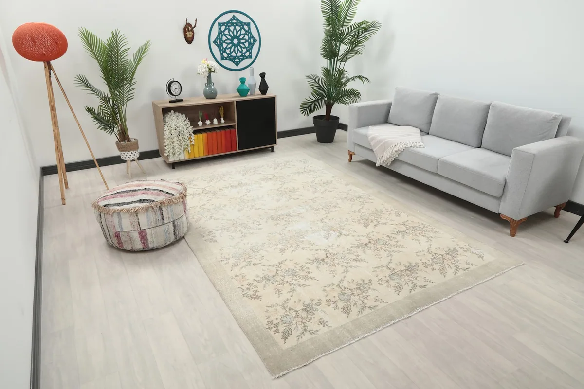 Wide view of the ivory floral rug enhancing a modern living room's decor