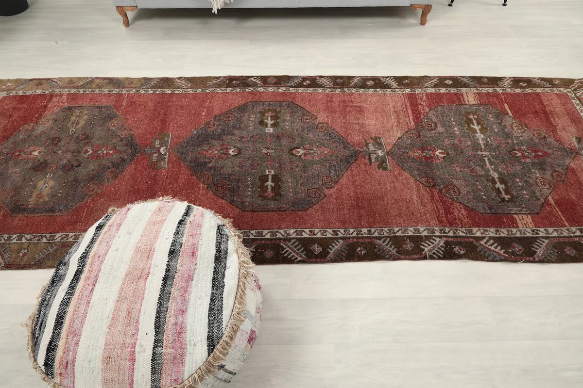 Top-down view of the runner rug, emphasizing the repeating medallion pattern