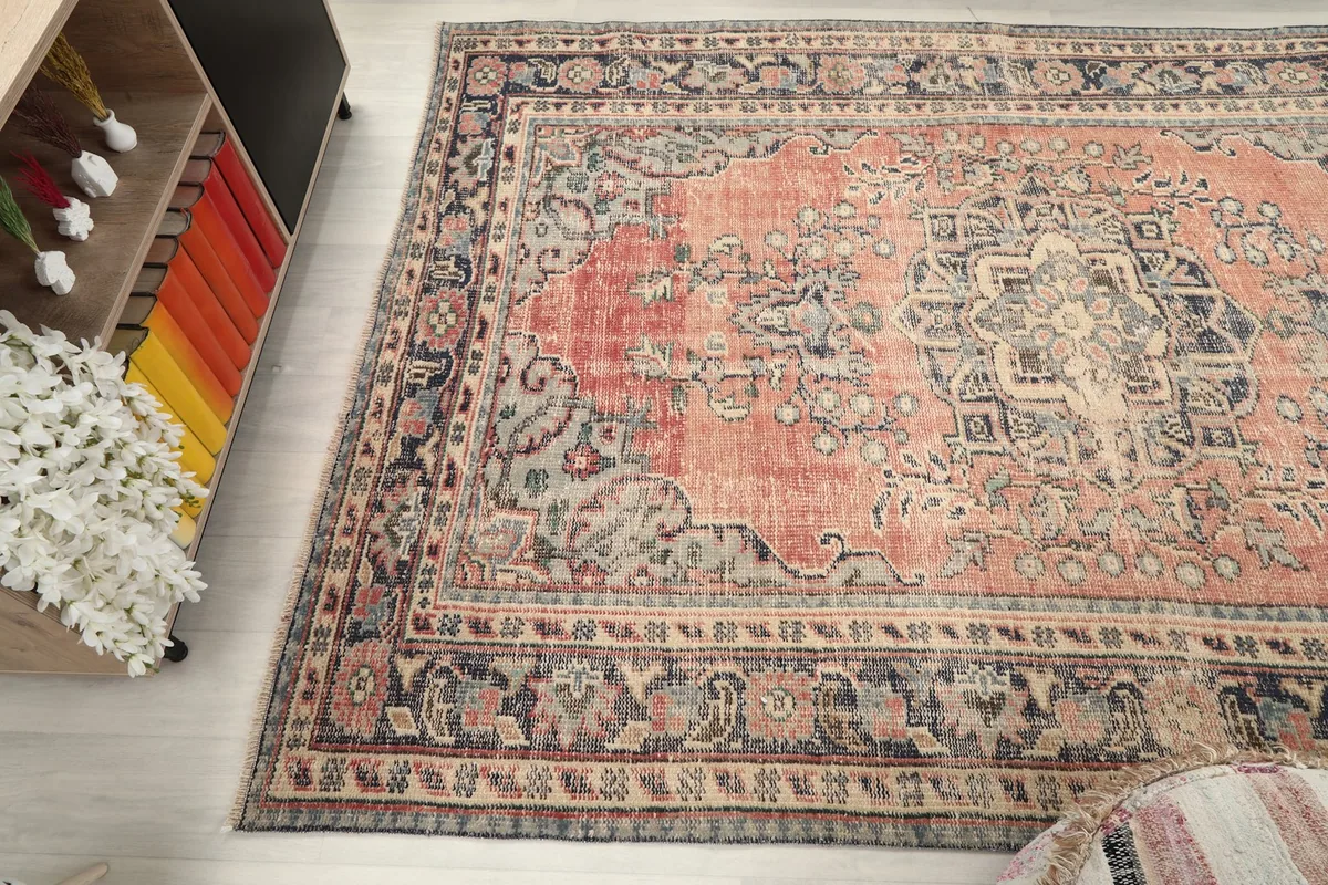 View from above at an angle, capturing the overall pattern and color balance of the rug