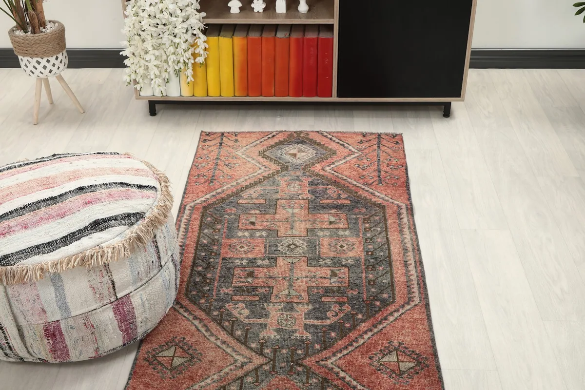 Top-down view of the vintage runner rug in a room, showcasing its placement relative to furniture