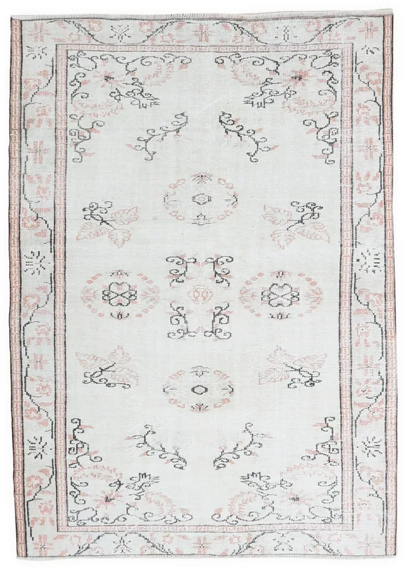 Full top view of the 5'10" x 8'4" ivory, rose, and black vintage Anatolian area rug.