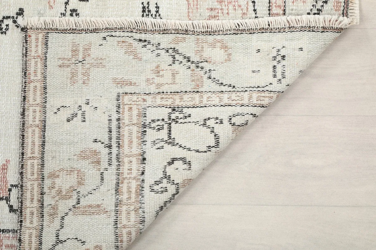 Underside view of the rug, showing the reverse of the hand-knotted construction.