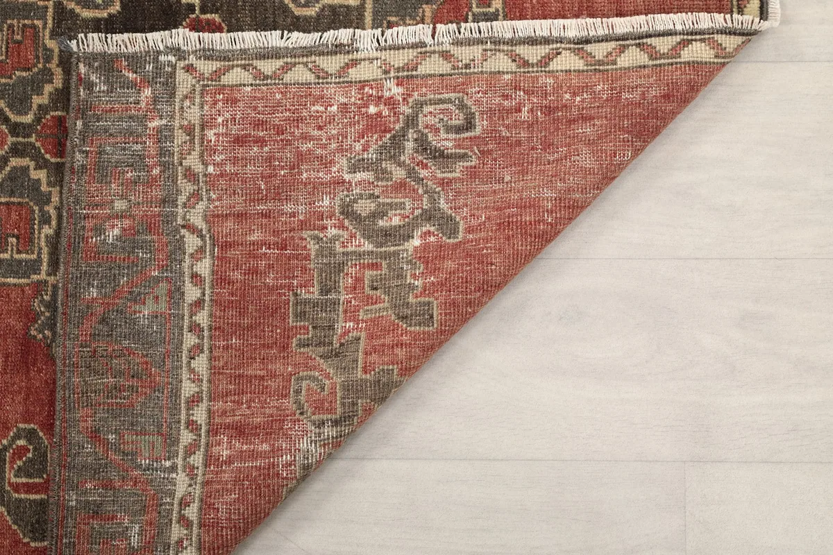 Underside view of the rug, showing the cotton foundation and hand-knotted construction