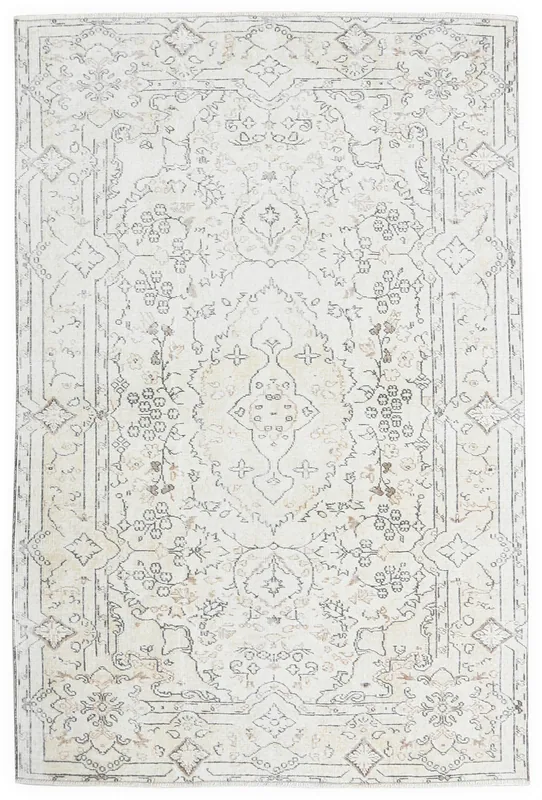 Full overhead view of the ivory and gray vintage Anatolian rug with a central medallion