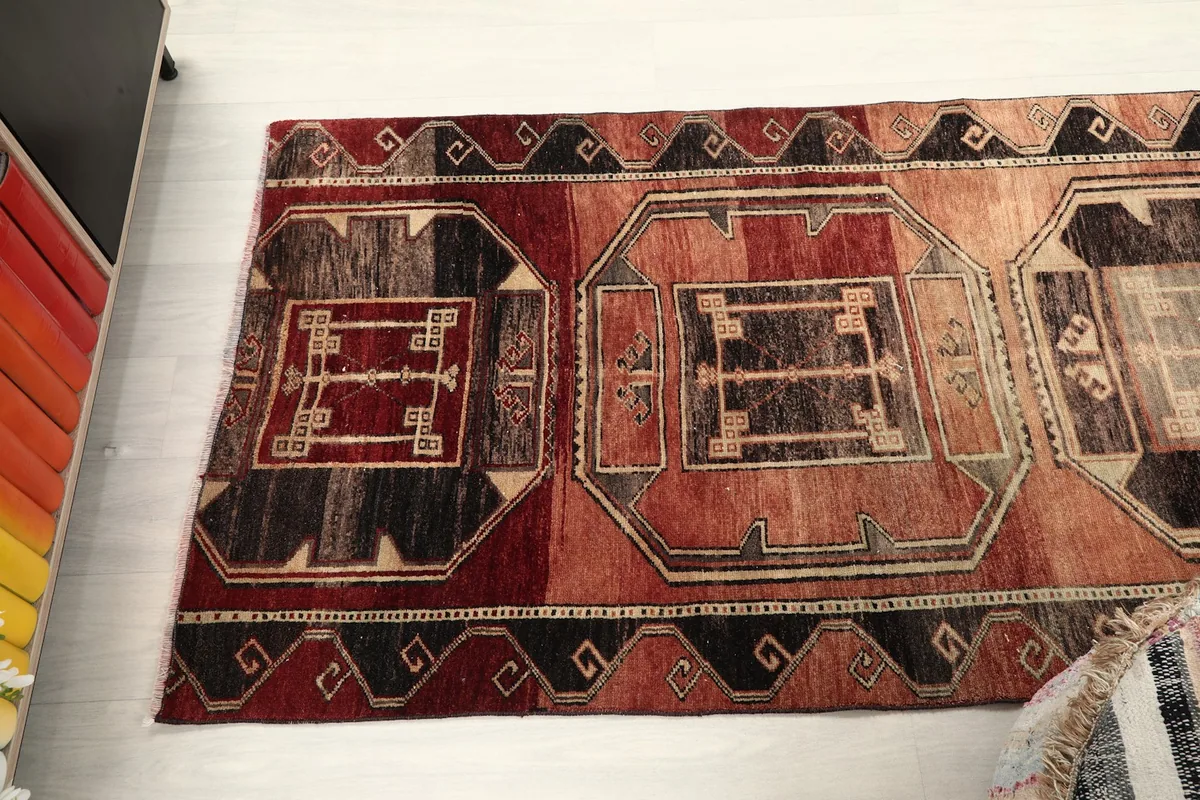 Overhead view of a segment of the runner rug, displaying multiple motifs