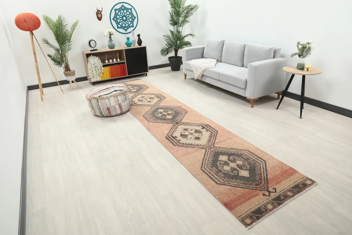 Angled view of the runner rug stretching through a living space, showcasing its length.