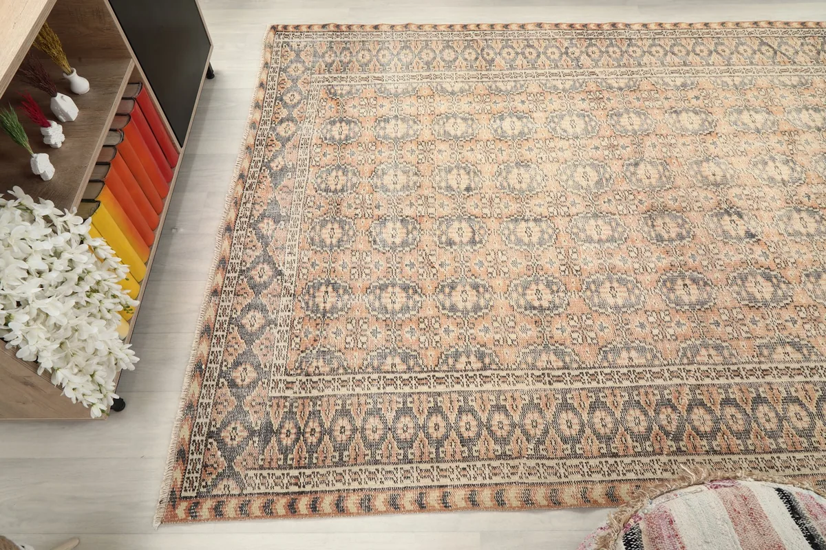 Full overhead shot of the vintage rug, emphasizing its overall pattern and color balance