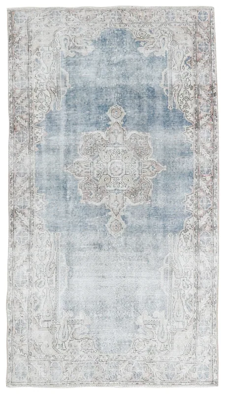Full overhead view of the 4x7 vintage blue and ivory medallion rug