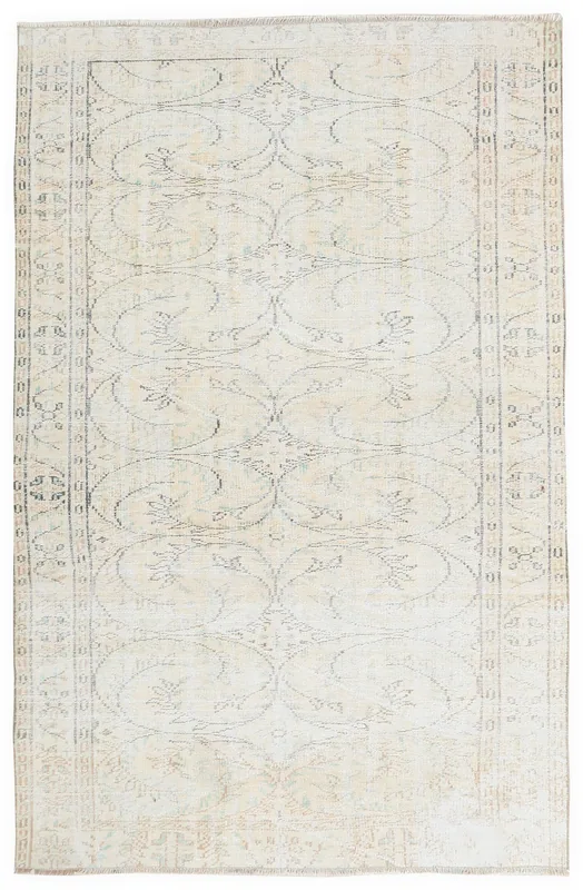 Full overhead view of the 5'3" x 8'3" ivory vintage Anatolian rug with floral and geometric patterns.