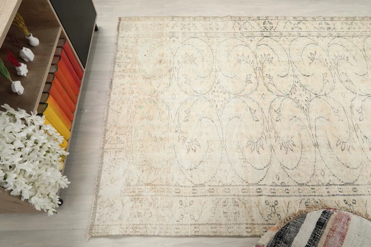 Angled view from above, showing the rug's full length and its interaction with the surrounding decor.