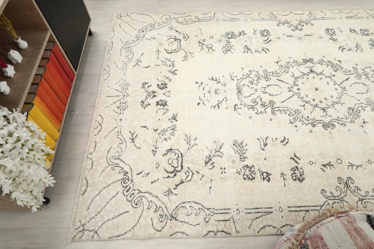 View across the rug from an angle, showing the overall design and how it complements the room's decor.