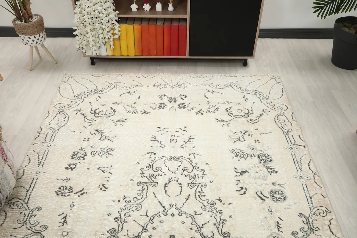 Overhead view of the rug, showcasing the full pattern from a slightly elevated perspective in a room.