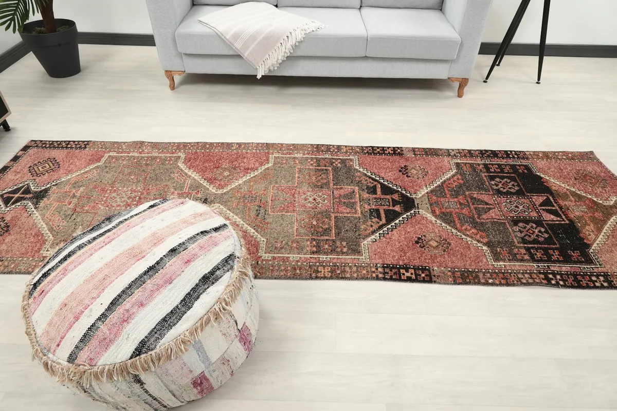 Full length view of the runner rug in a living area, demonstrating its scale and fit