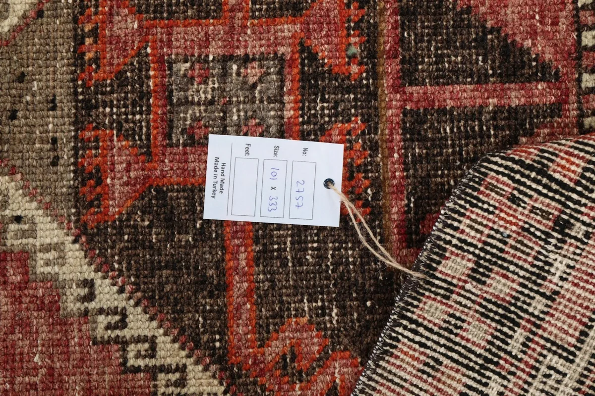 Close-up of the rug's back with a product tag displaying size and origin details