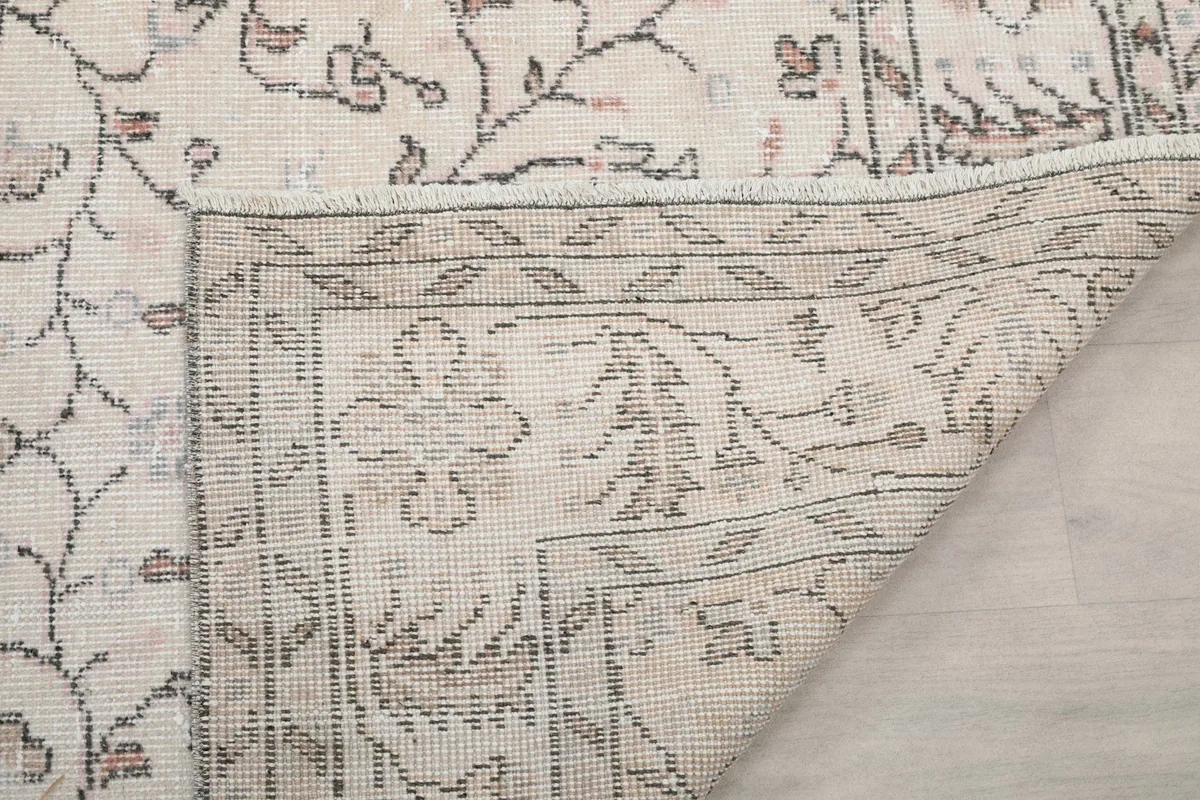 Close-up of the underside of the rug, showing the tight hand-knotting and the durable cotton foundation construction.