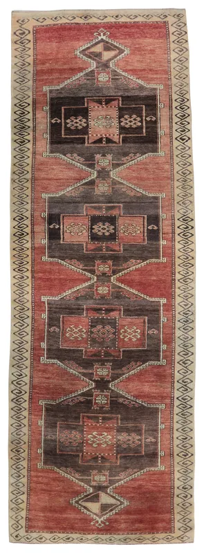 Full top view of the 3'10" x 12'2" rust and brown geometric Anatolian runner rug on a white background