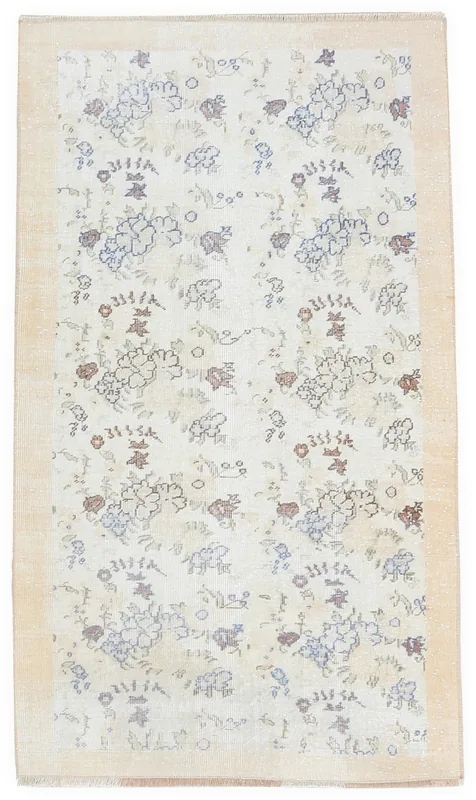 Full top view of the 4x6 cream vintage Anatolian rug with faded blue and rust floral patterns