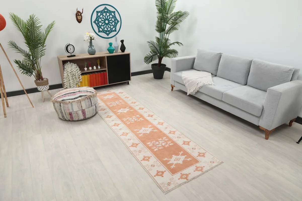 Angled view of the runner rug in a living room, showing its length and how it complements the decor.