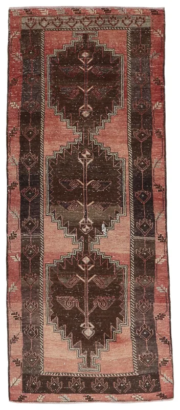 Full overhead view of the rose and brown vintage Anatolian runner rug