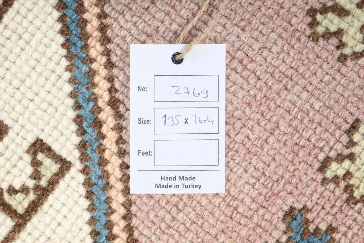 Close-up of the rug's tag, indicating its size and origin as Made in Turkey