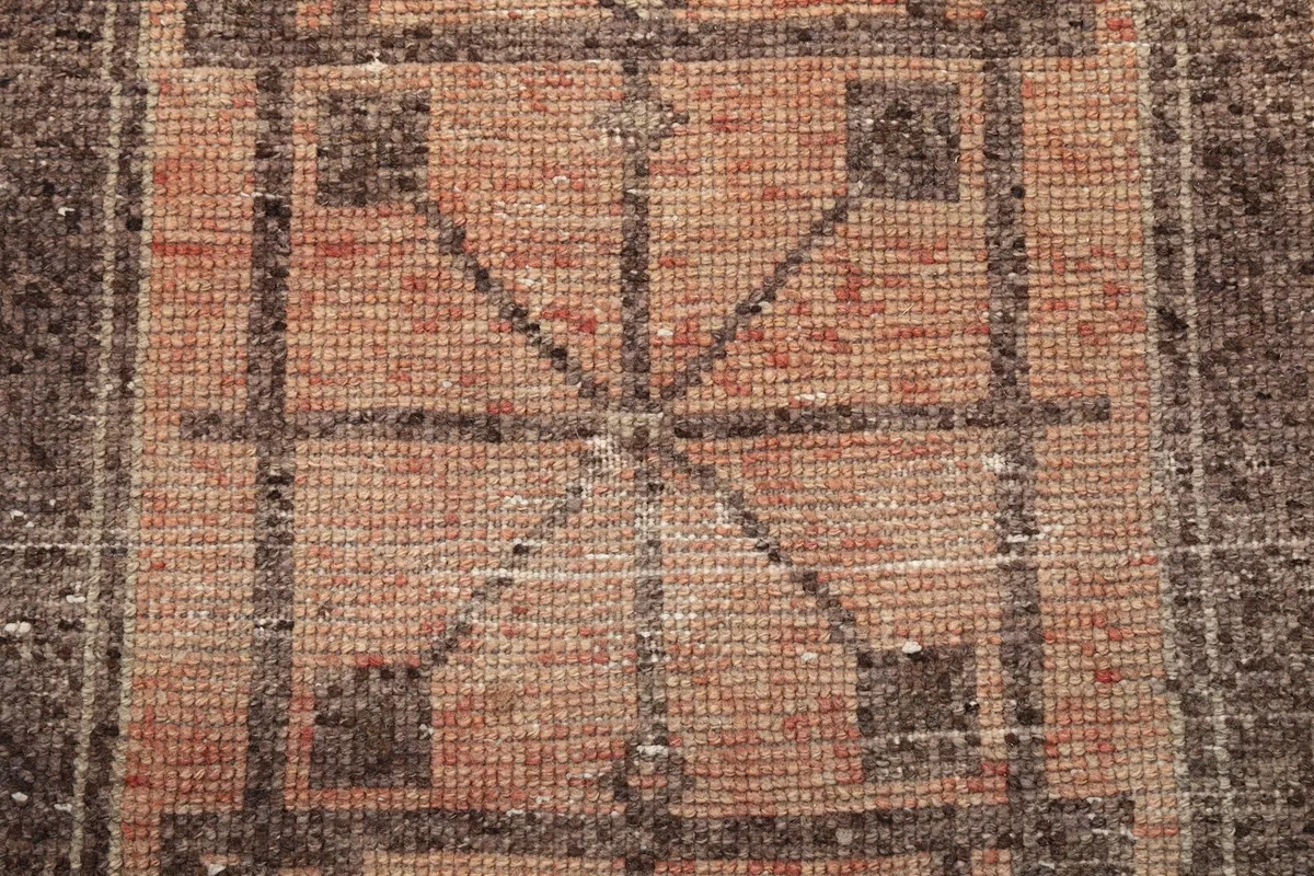 Close-up of the low wool pile texture and hand-knotted detail of the vintage runner