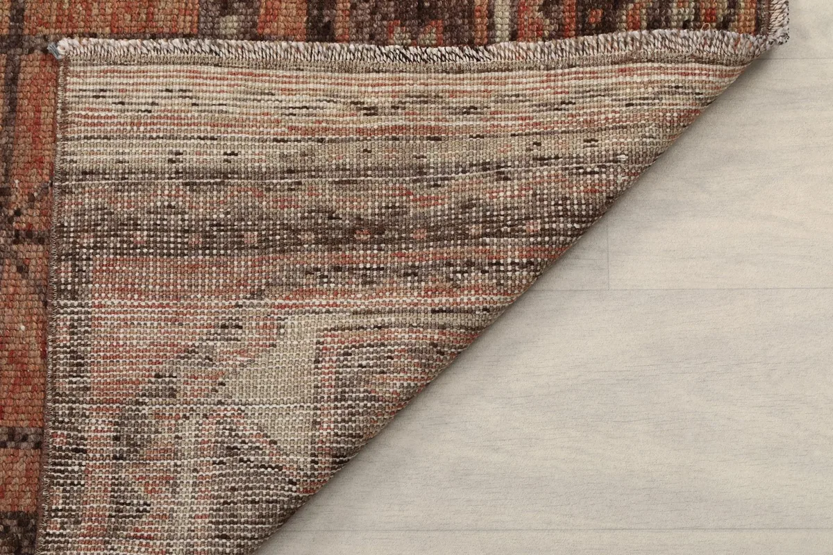 Detailed view of the reverse side of the rug, showing the consistent weave and foundation
