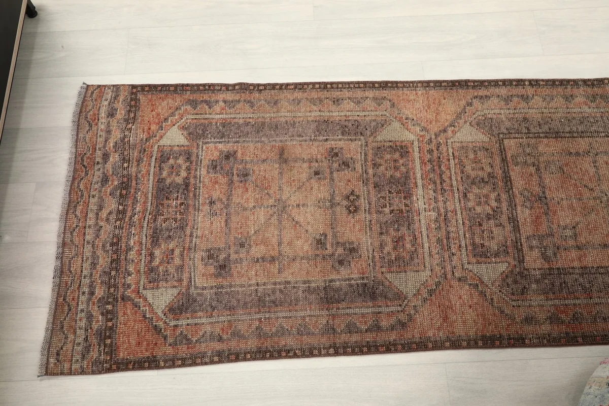 Overhead view of a segment of the runner rug, showcasing multiple geometric medallions